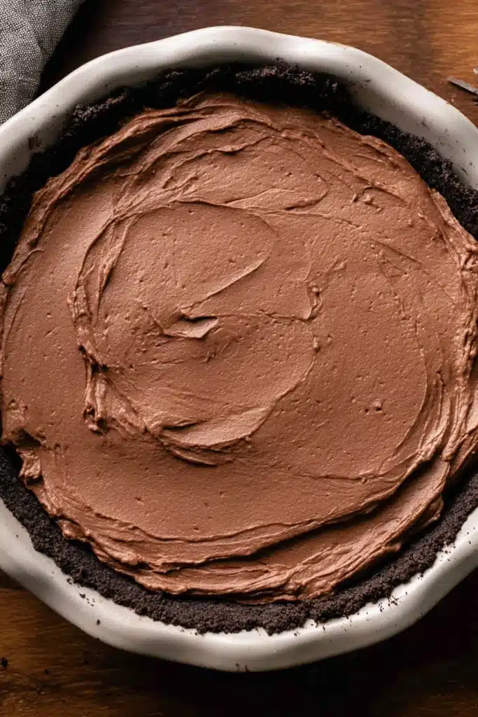 Chocolate filling layer in Oreo crust for no-bake chocolate peanut butter pie