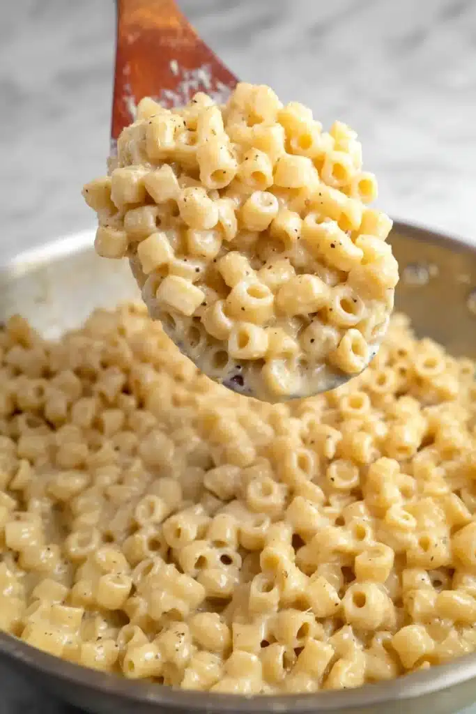 One-Pan Butter Parmesan Pasta (20-Minute Creamy Dinner Recipe) 10 One-Pan Butter Parmesan Pasta lifted from skillet with creamy sauce