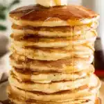 Pancakes – Fluffy & Quick Breakfast You’ll Love 13 Tall stack of fluffy pancakes with maple syrup and butter on top