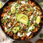 Ground Beef and Zucchini Skillet | Easy & Delicious Dinner 5 Mexican-style ground beef and zucchini skillet with avocado, corn, and lime in cast iron pan