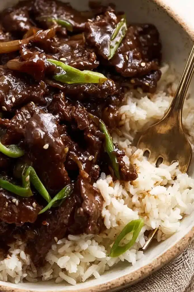 Beef Stir Fry with Honey Pepper Sauce | Quick & Delicious 9 Beef stir fry with honey pepper sauce served over white rice in a bowl
