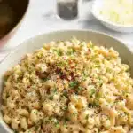 One-Pan Butter Parmesan Pasta (20-Minute Creamy Dinner Recipe) 12 One-Pan Butter Parmesan Pasta topped with parsley, parmesan, and red pepper flakes in a white bowl