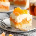 Orange Creamsicle Cake Recipe – Simple & Refreshing Treat 30 Orange creamsicle cake slice with whipped topping and mandarin orange