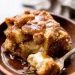 Serving of baked cream cheese French toast casserole with syrup
