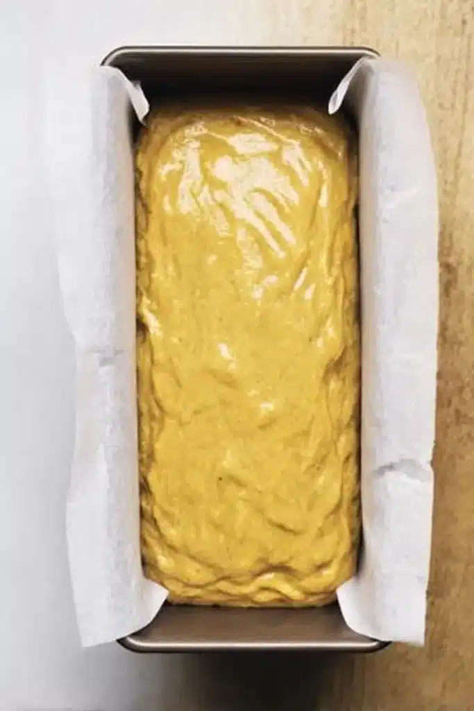 Pumpkin Bread – Rich, Moist & Irresistible Fall Favorite 10 Pumpkin bread batter in a parchment-lined pan, ready to bake