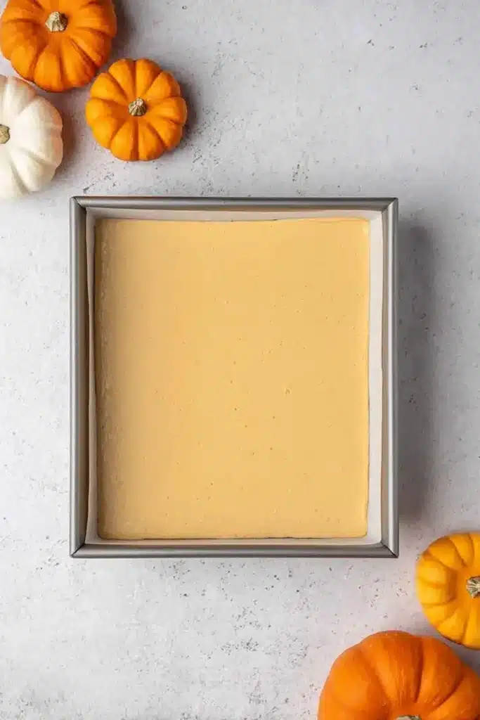 The Best Pumpkin Cheesecake Bars Ever batter in baking pan before oven