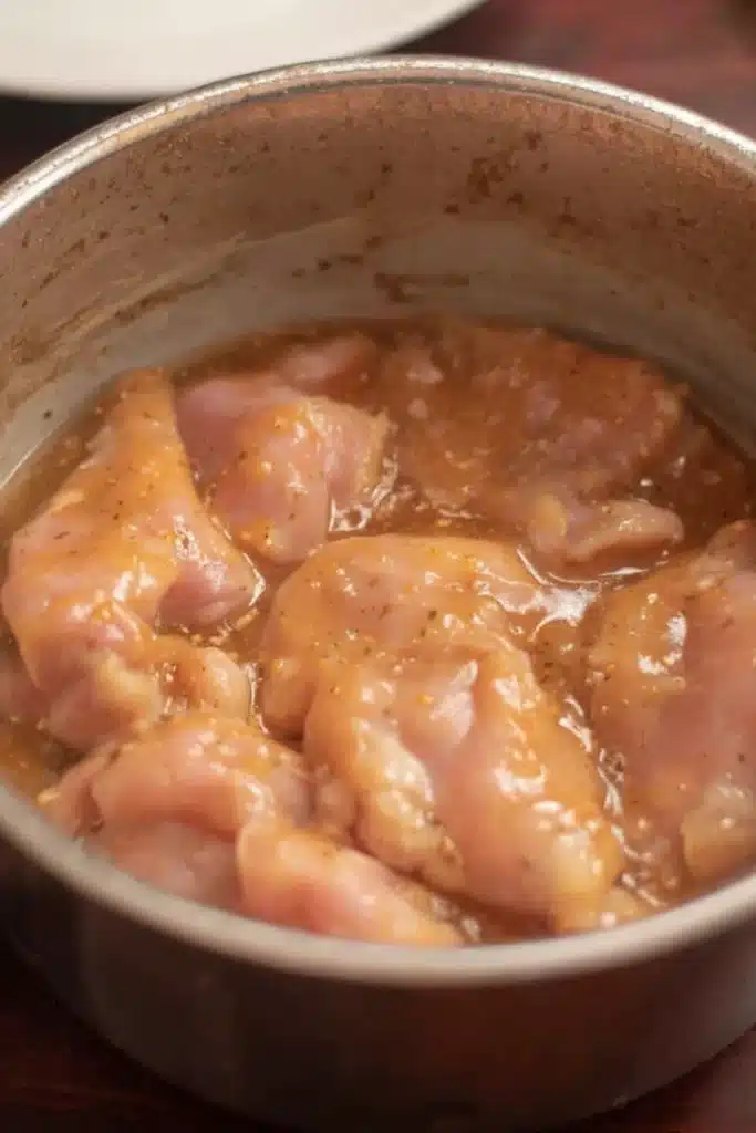 Sweet and Sour Chicken Recipe | Crispy, Tangy, Amazing 11 Chicken thighs marinating in soy sauce mixture for sweet and sour chicken