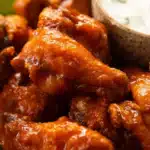 Baked Buffalo Wings – Ultimate Crispy Recipe You’ll Love 14 Crispy baked buffalo wings coated in spicy sauce with blue cheese dip and celery