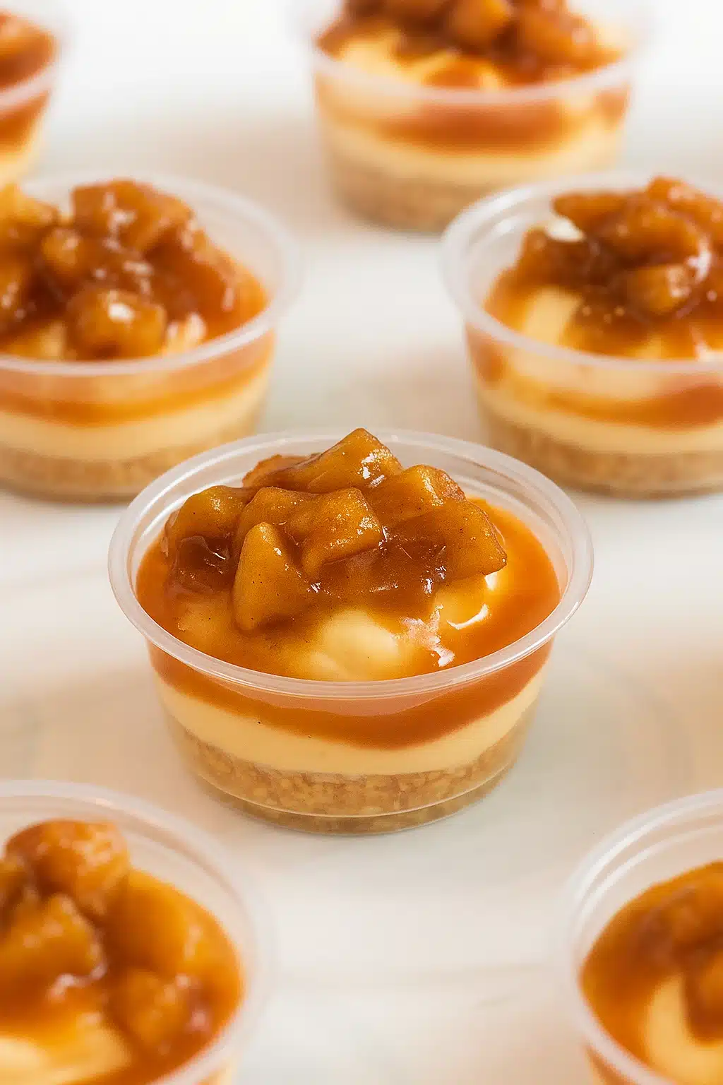 Mini caramel apple dessert cups with caramel mousse and cinnamon apples