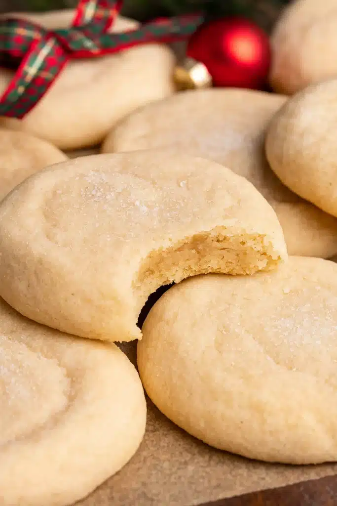 Chewy Sugar Cookies Recipe – Soft, Buttery & Amazing Treat 5 Soft chewy sugar cookies with a bite showing their tender center