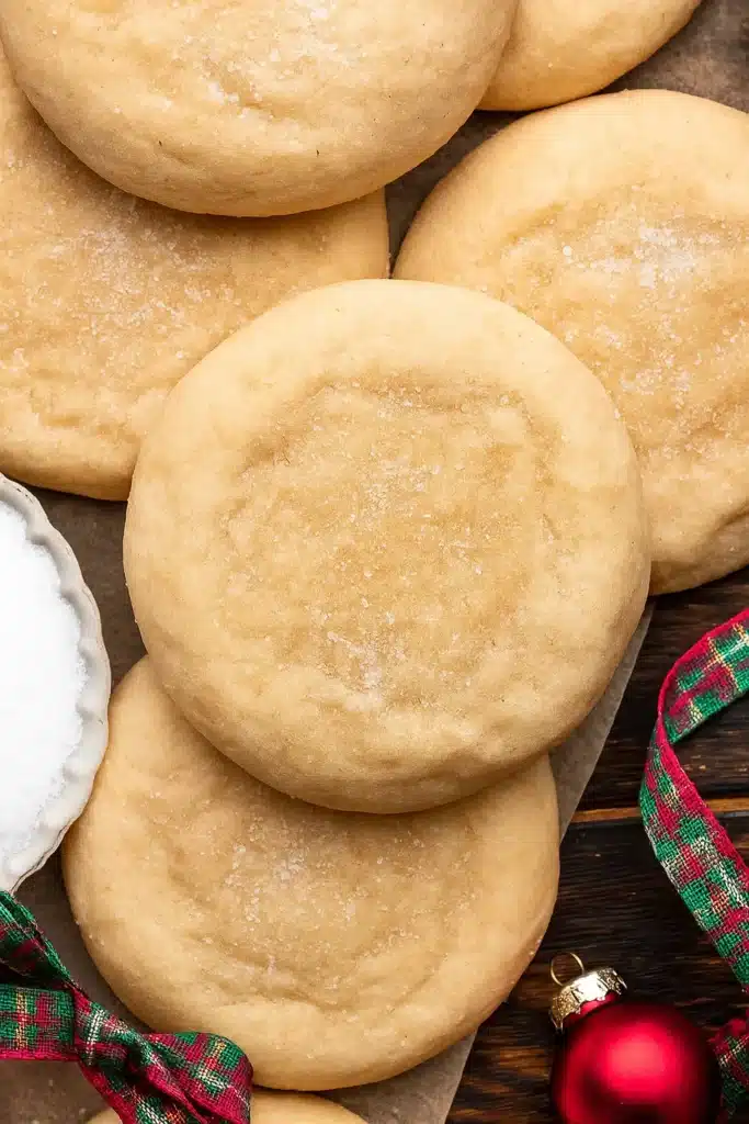 Chewy Sugar Cookies Recipe – Soft, Buttery & Amazing Treat 21 Close-up of chewy sugar cookies with sugar topping and holiday ribbon