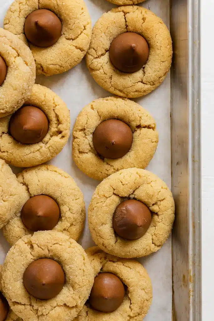 Classic Peanut Butter Blossoms cooling on baking tray