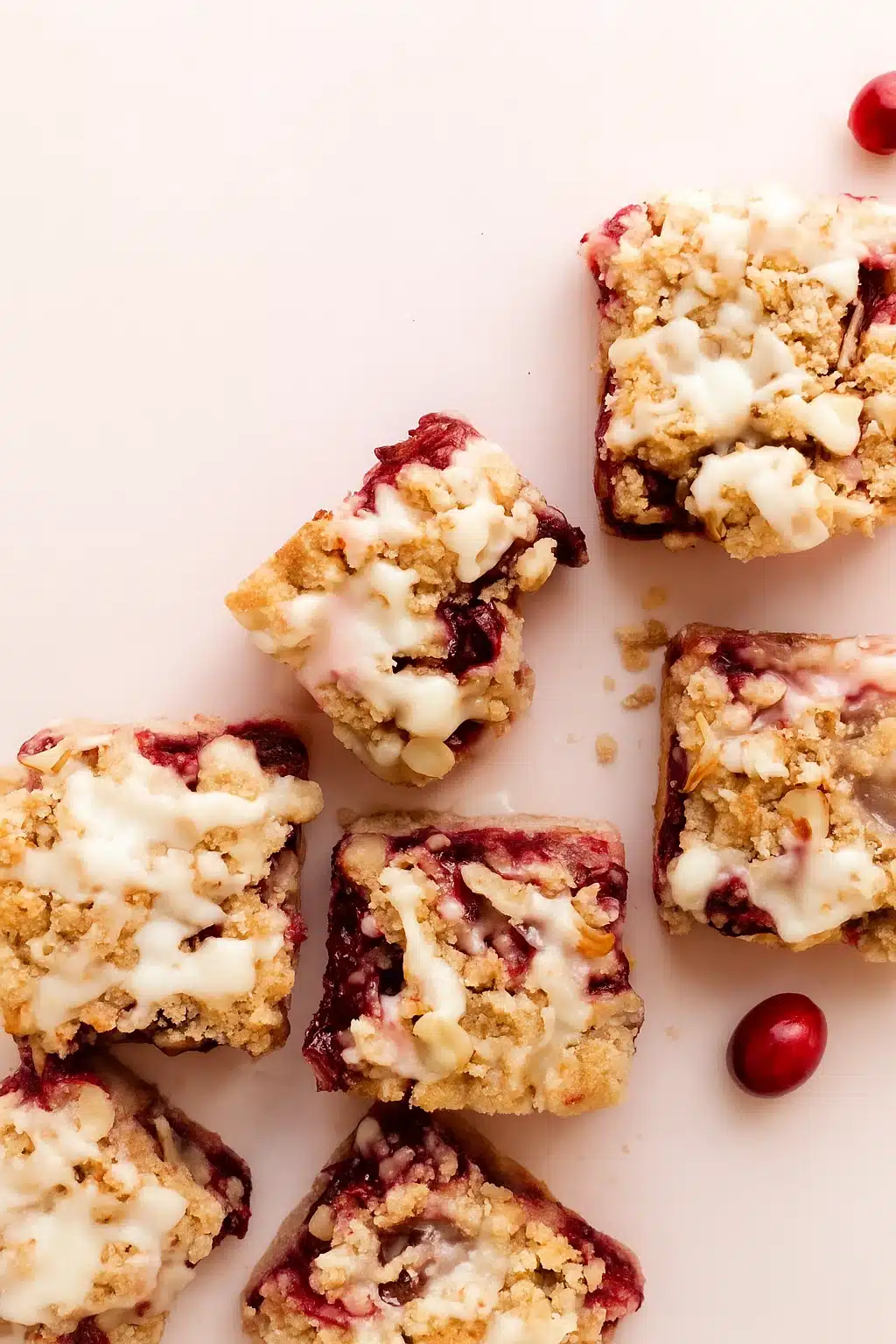 Cranberry Bars with buttery crumble and white icing drizzle