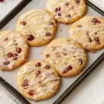 Cranberry Orange Cookies | Soft, Chewy & Amazing Treat 10 Cranberry orange cookies with icing on a baking tray