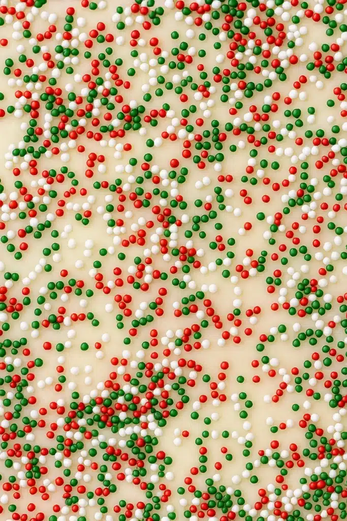 The Best Christmas Fudge | Simple, Festive & Delicious 20 The Best Christmas Fudge Recipe topped with red green and white sprinkles