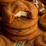 Gingerbread Cheesecake Cookies | Easy Holiday Treat 14 Stack of gingerbread cheesecake cookies with creamy filling on rustic table