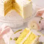 Vanilla Cake Recipe | Simple, Fluffy & Amazing Dessert 6 Vanilla cake recipe with buttercream frosting and colorful sprinkles on a glass stand