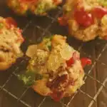 Old fashioned fruitcake cookies with candied cherries and pecans on cooling rack