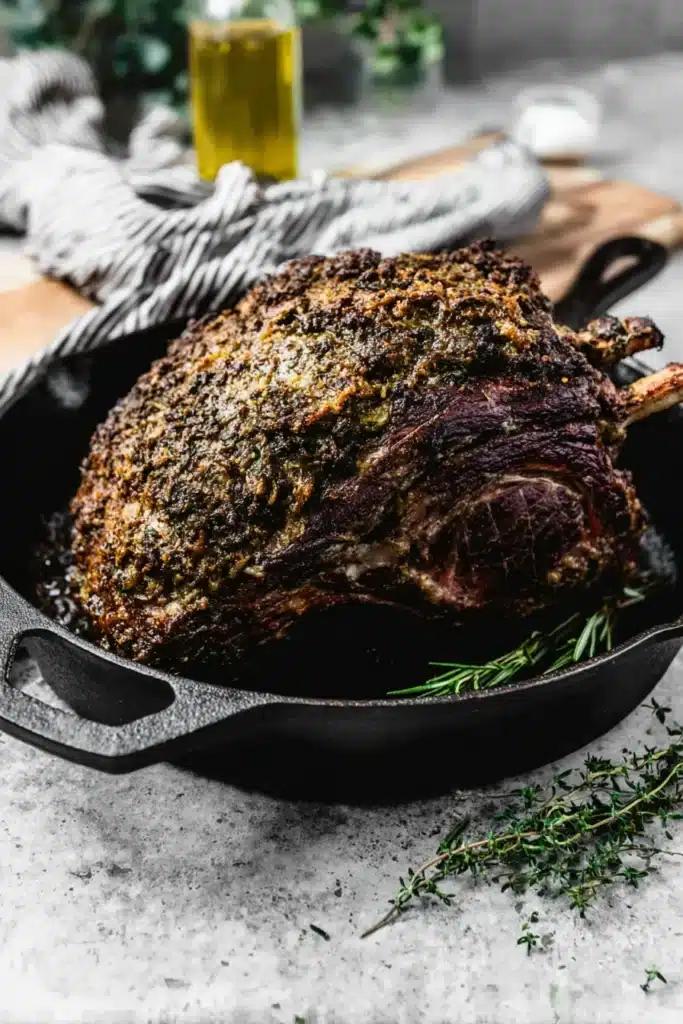 Perfect Prime Rib (Foolproof Method for Juicy, Tender Roast) 18 Roasted prime rib with garlic herb crust in cast-iron skillet