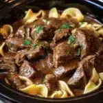 Slow Cooker Beef and Noodles | Easy Comfort Recipe 10 Slow Cooker Beef and Noodles in rich gravy with parsley garnish