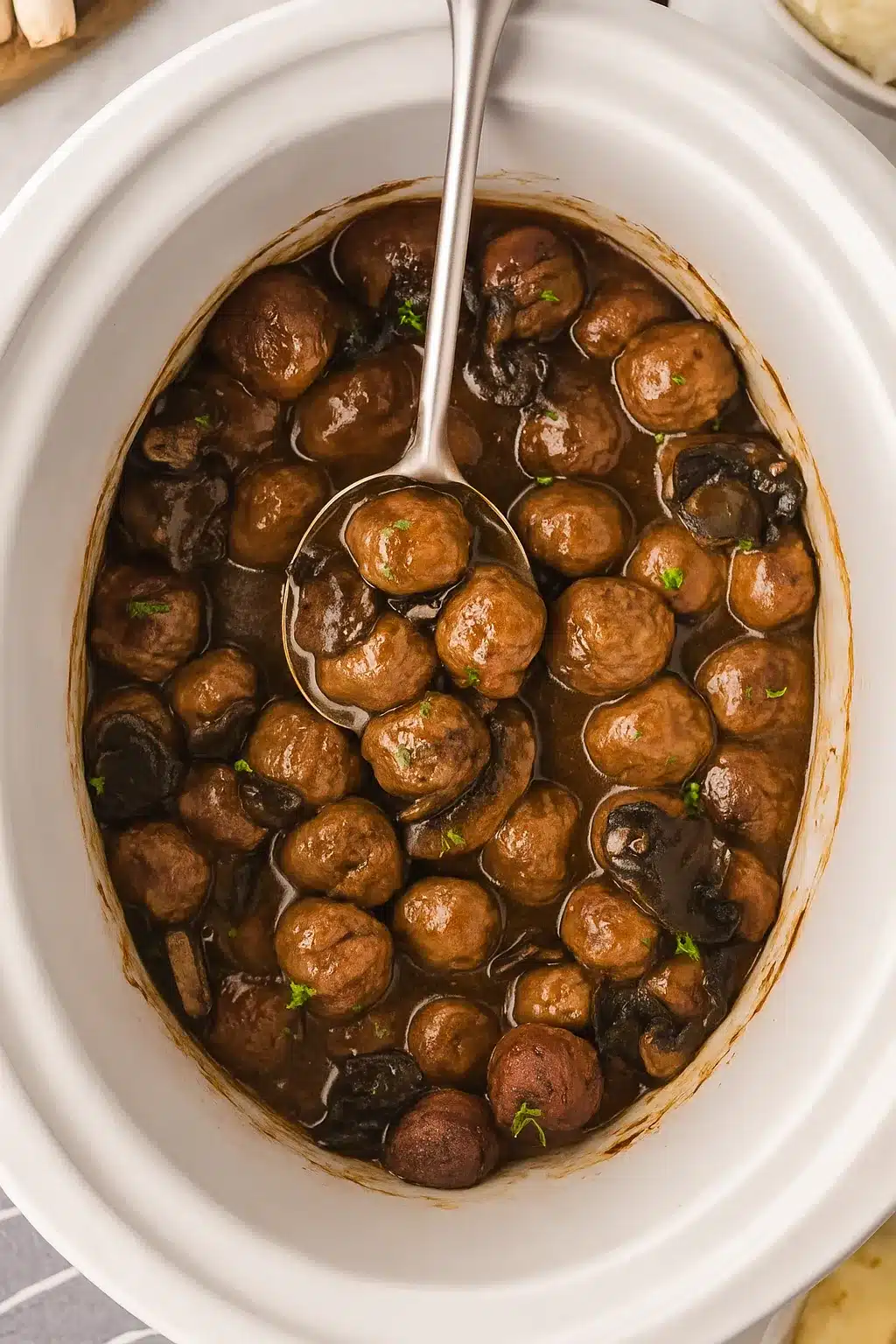 Salisbury steak meatballs in slow cooker with rich brown gravy
