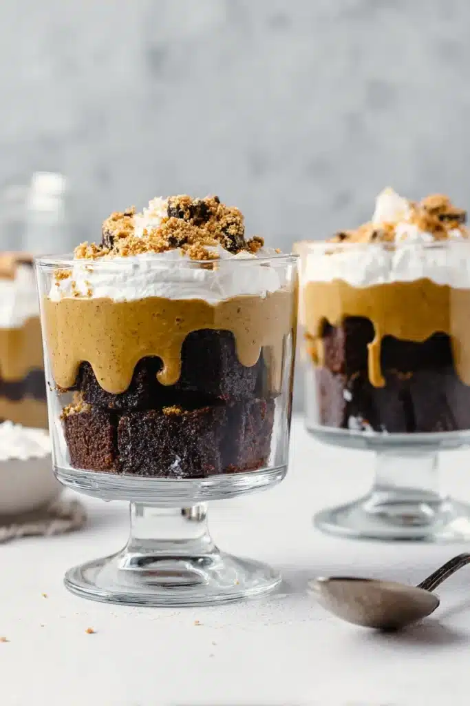 Brownie Trifle Recipe – Decadent, Easy & Wholesome Dessert 9 Brownie trifle recipe in glass cups with brownies, mousse, and whipped cream
