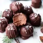 Chocolate peppermint truffles with sea salt on marble plate