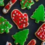 Colorful Christmas sugar cookies with red and green icing and festive sprinkles