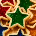 Close-up of star-shaped stained glass cookies with colorful candy centers