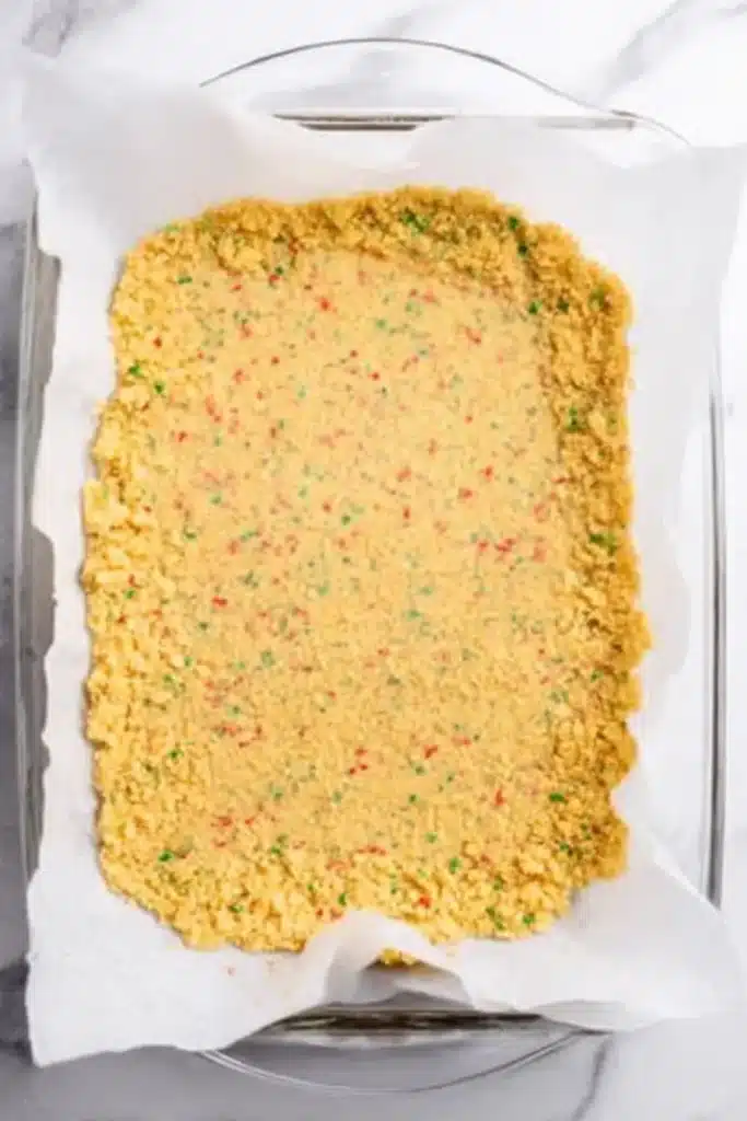 Lasagna Dessert Recipe – Easy, Creamy & Festive Treat 13 Golden cookie crumb crust pressed in baking dish for lasagna dessert