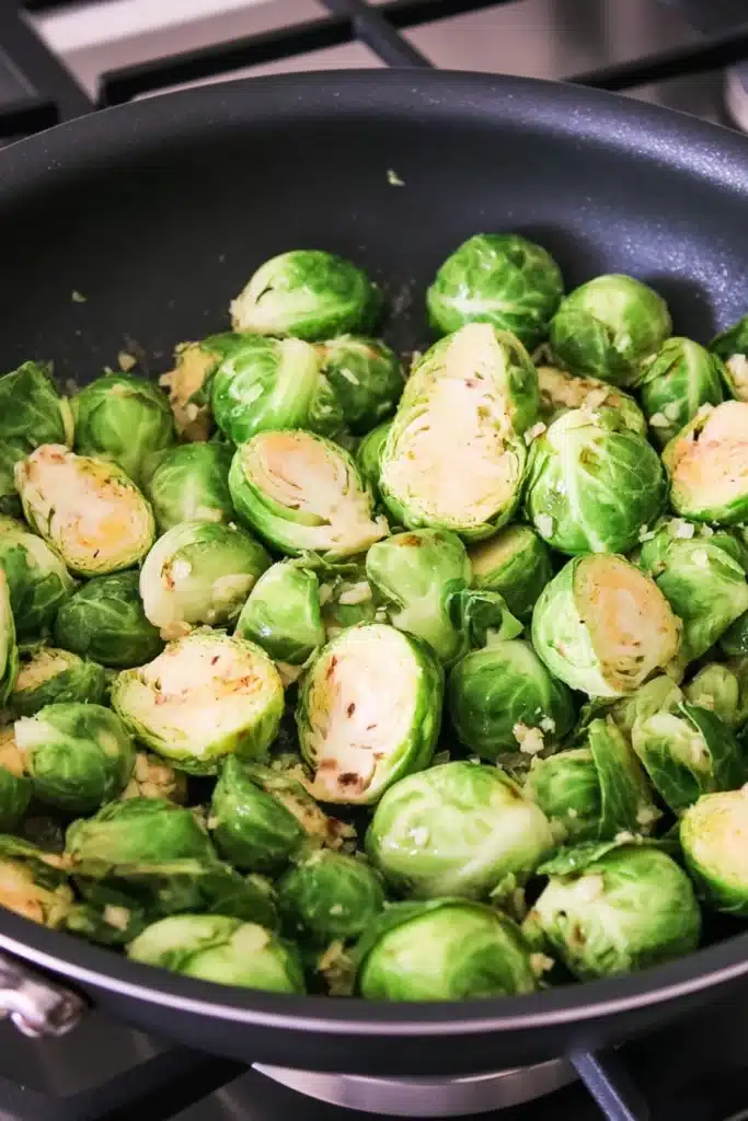 Creamy Brussels Sprouts sautéed in pan with garlic and butter
