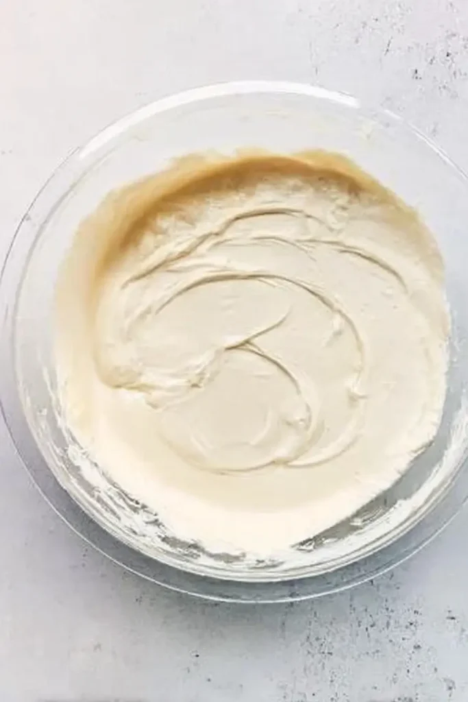 Pumpkin Cheesecake Bars | Amazing Creamy Fall Treat 18 Smooth cheesecake batter in a glass mixing bowl