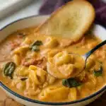 Creamy tomato tortellini soup with spinach and toasted bread