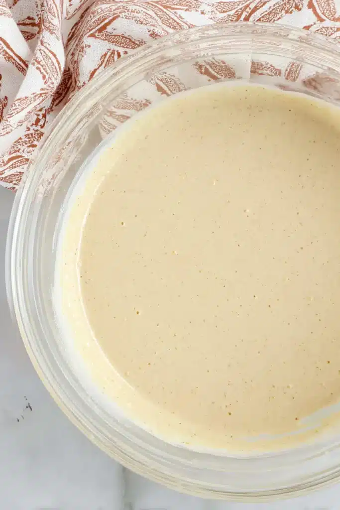 gingerbread cheesecake batter in glass bowl ready to bake