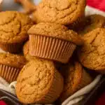 Freshly baked gingerbread muffins in a tray with coarse sugar topping