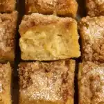 Close-up of gluten-free cinnamon sugar apple cake with crumb topping