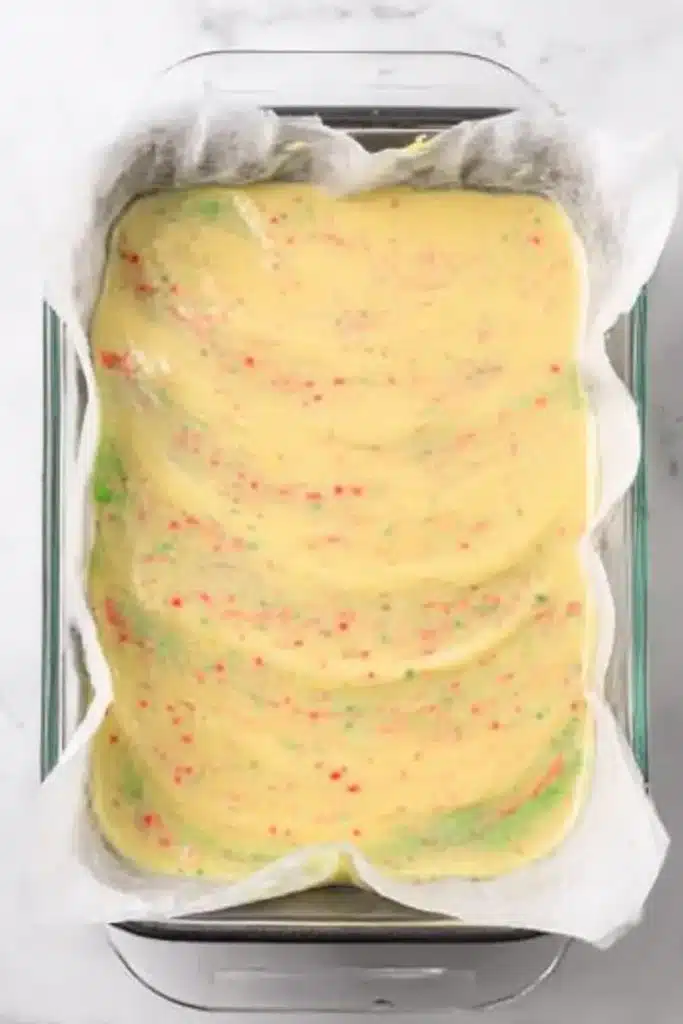 Lasagna Dessert Recipe – Easy, Creamy & Festive Treat 14 Creamy pudding layer with festive sprinkles in baking dish for lasagna dessert