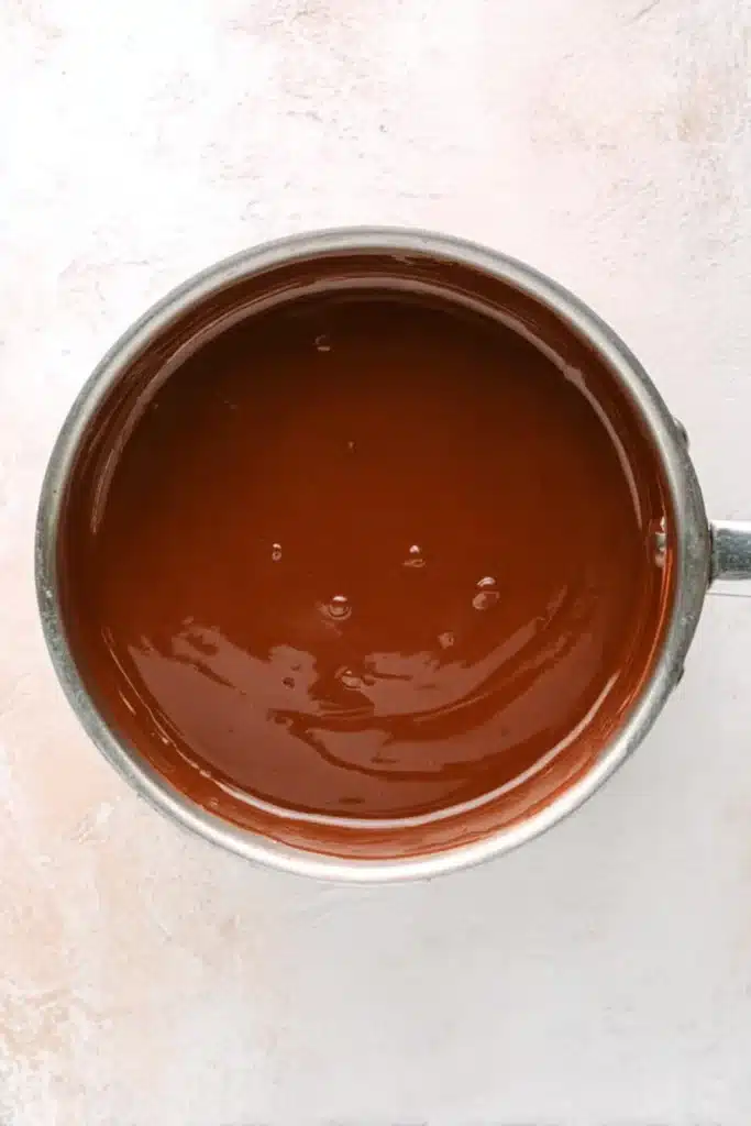 Peppermint Truffles – Easy, Delicious, and Festive Treats 18 Melted chocolate ganache in saucepan for peppermint truffles