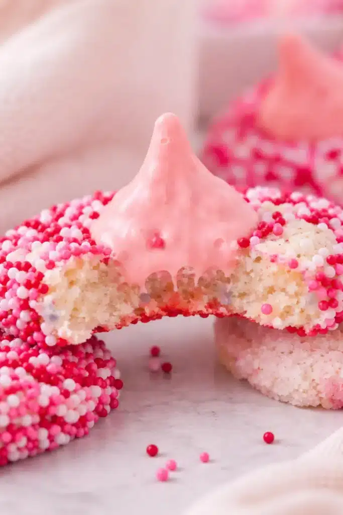 Bitten Strawberry Kiss Cookie with pink chocolate and sprinkles