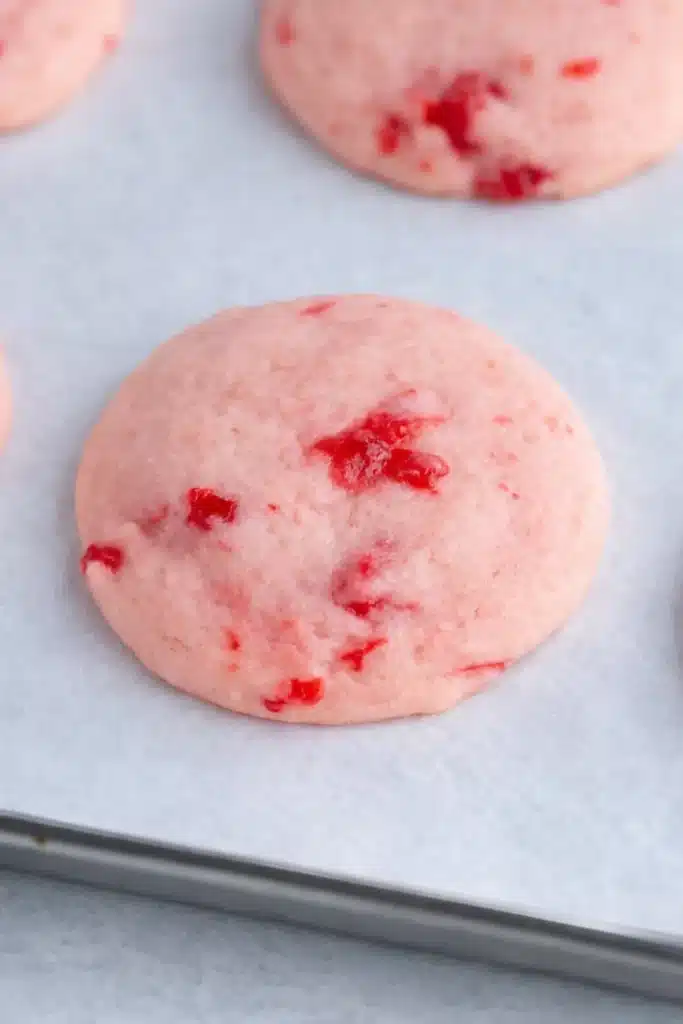 Cherry Almond Cookies | Simple, Sweet & Irresistible Treats 6 Soft pink cherry almond cookie on parchment paper