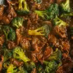 Chinese beef and broccoli stir-fry in glossy brown sauce with bright green broccoli