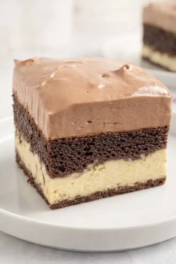 Love Cake Recipe – Irresistibly Creamy & Romantic Dessert 8 Single slice of chocolate love cake with creamy ricotta and mousse layers on white plate