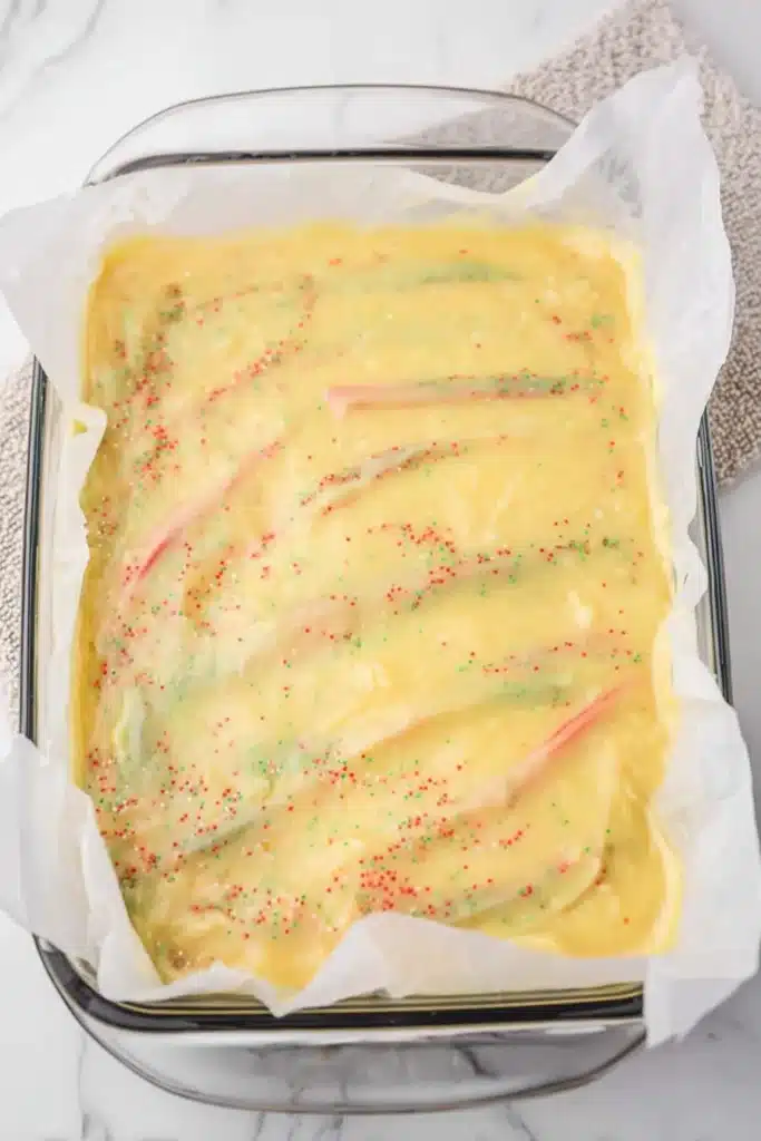 Christmas Cookie Lush Recipe | Easy, Festive & Delicious 29 Pudding layer for Christmas Cookie Lush spread in glass baking dish