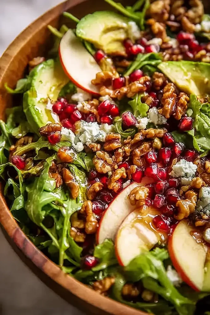 Christmas Salad Recipe: A Fresh, Festive Bowl of Color and Crunch 8 Christmas salad close-up with avocado, walnuts, pomegranate, and cheese