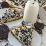 cookies and cream dessert pizza with cream cheese frosting and milk bottle