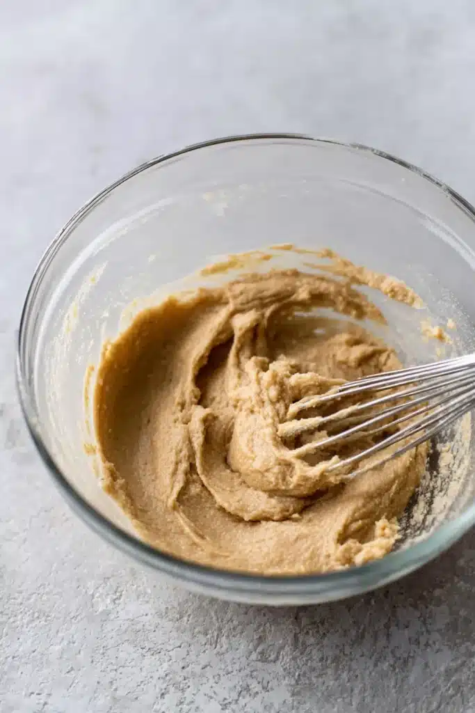 Red Velvet Cupcake Cookies | Irresistibly Soft & Creamy 13 Creamed butter and sugar mixture for red velvet cupcake cookies in glass bowl