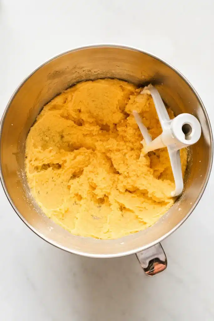 Slice and Bake Heart Cookies | Easy Valentine’s Recipe 12 Creamy cookie dough for slice and bake heart cookies in mixing bowl on white-gray surface