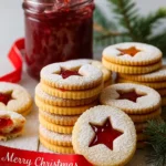 festive jam christmas biscuits with star cutouts and powdered sugar