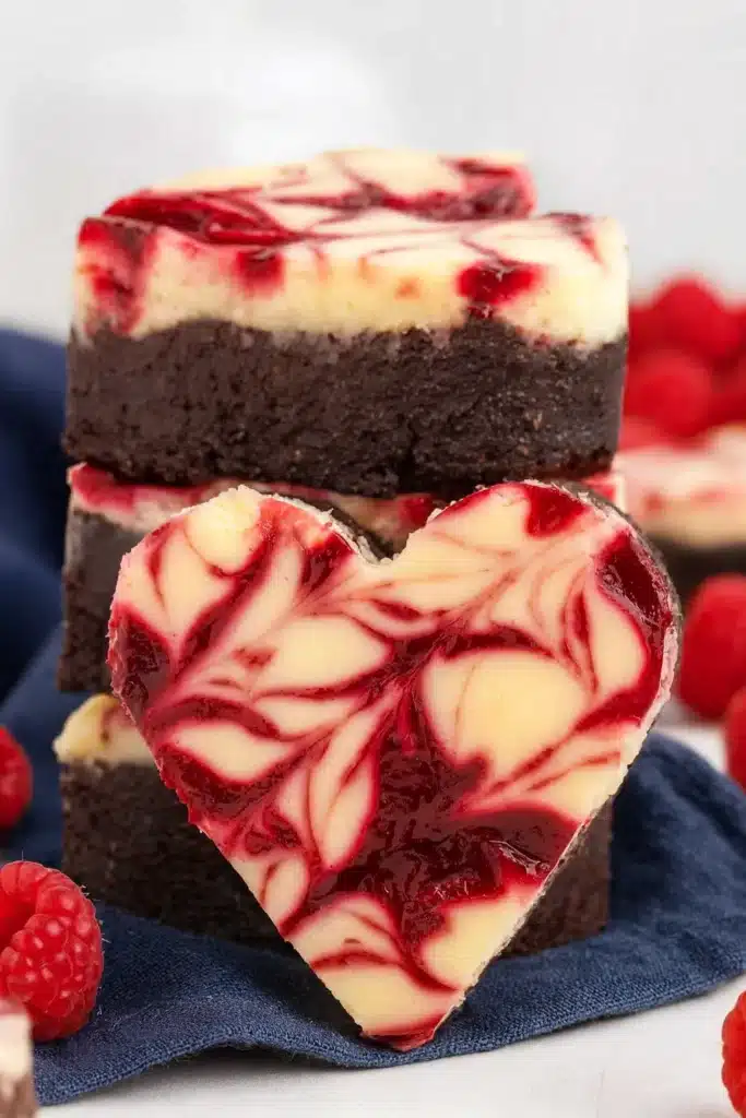 Heart Shaped Brownies – Delicious Fudgy Valentine Treat 7 Heart shaped raspberry cheesecake brownie with rich chocolate layers