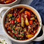 Cowboy soup with beef, potatoes, and vegetables in tomato broth